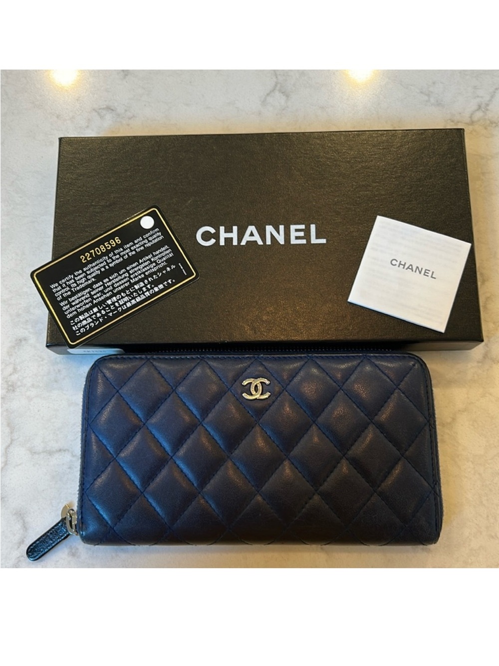 CHANEL Navy Quilted Zip-Around Wallet with Silver CC